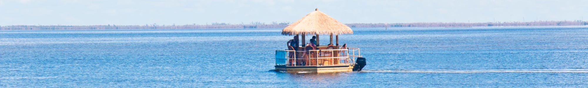 Crab Island Tiki Boat Adventures Included with Your Stay at Liquid Assets